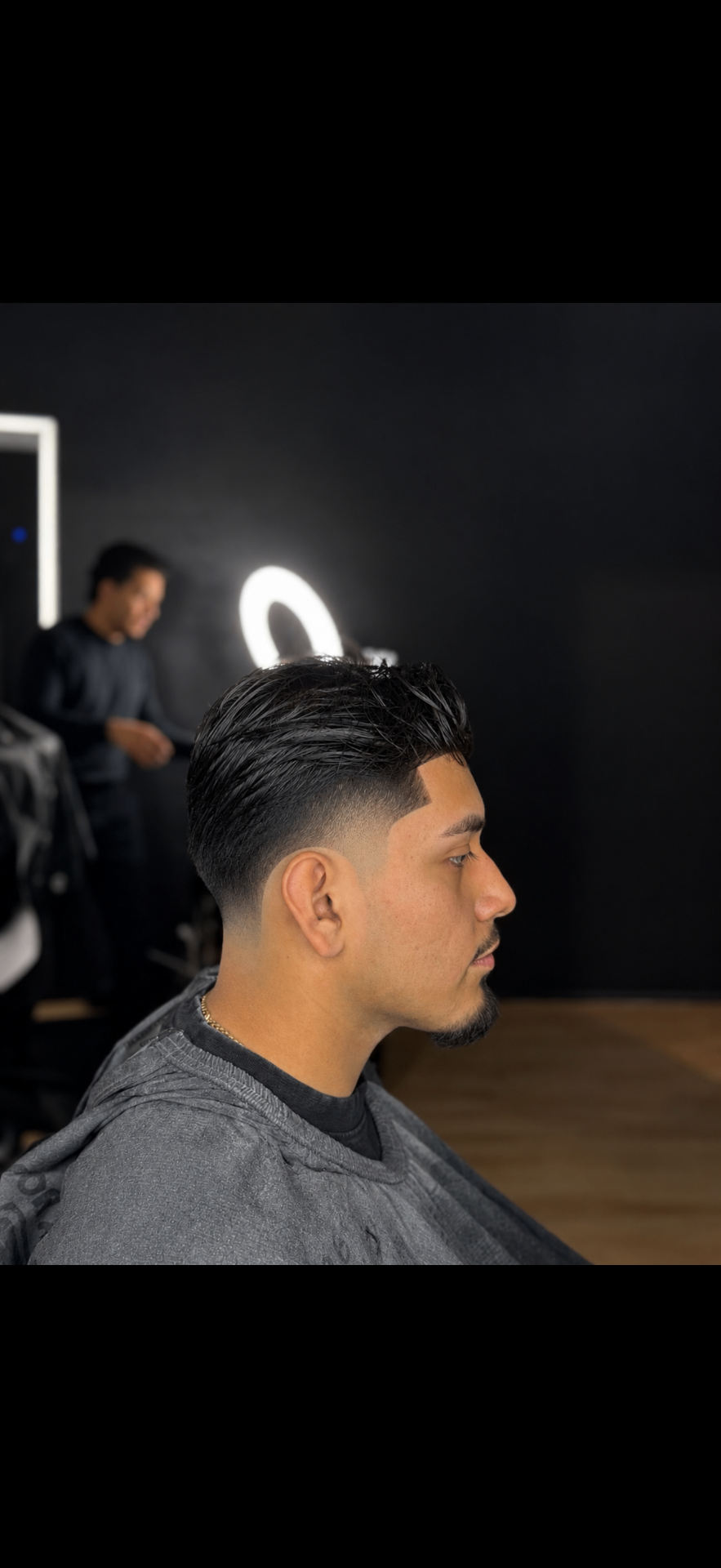 Slick side-swept style with a clean mid fade