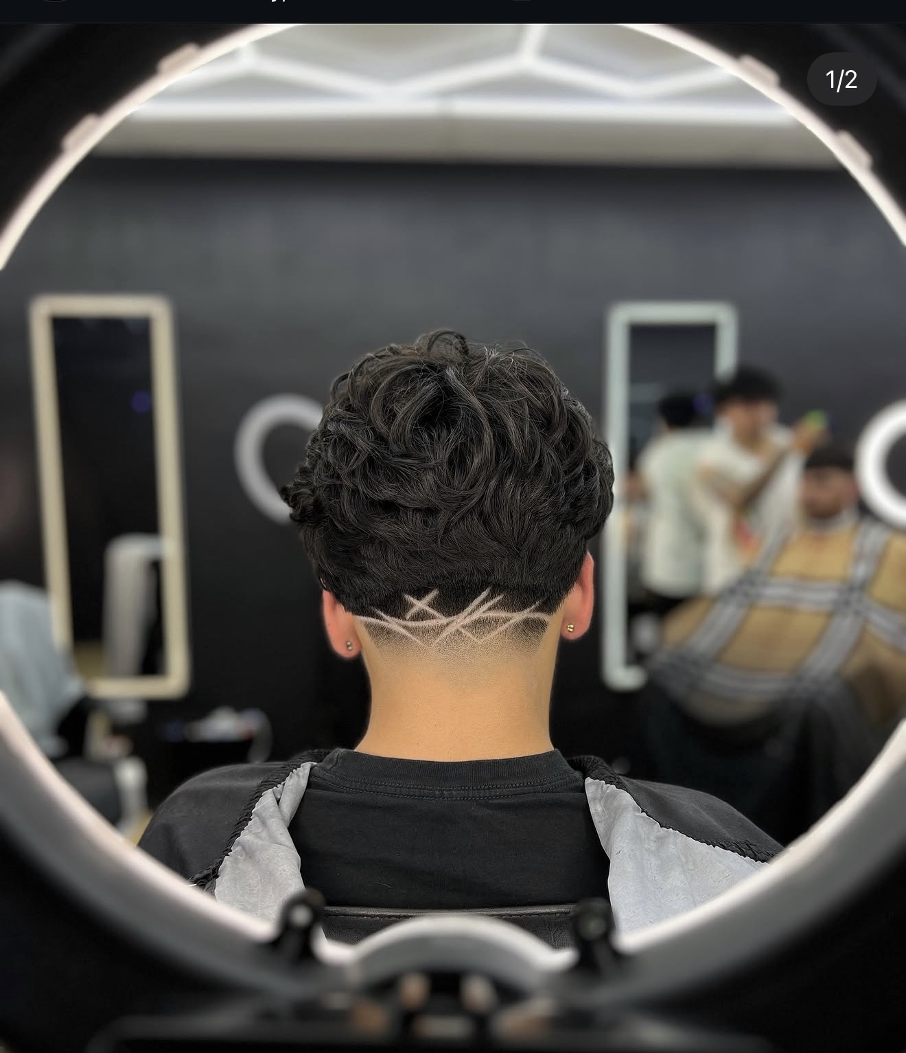 Crossed razor freestyle design on a taper fade